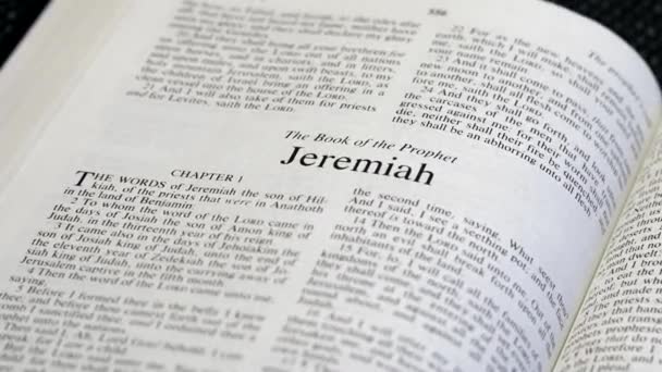 Close Shot Bible Page Turning Book Jeremiah — Vídeos de Stock