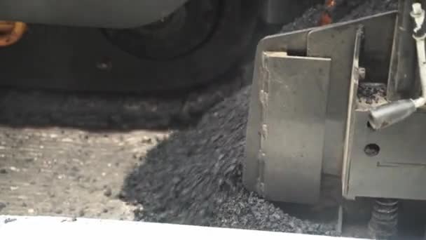 Close Gravel Pouring Asphalt Paver Chute Steam Smoke Heat — Video