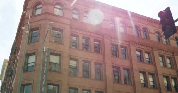 Vintage Brick Apartment Building Looms Sunlight Beaming Roof — Stock Video