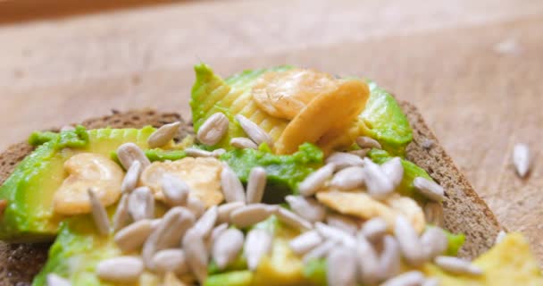 Healthy Avocado Toasts Rye Bread Sliced Avocado Nuts Sesame Seeds — Video