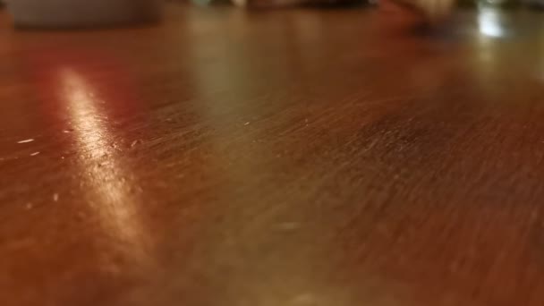 Numerous Dice Rolling Wooden Table Top Static Low Angle Close — Vídeos de Stock