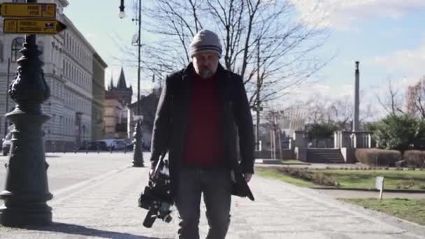 Camera Operator Holding Gear Walking Different Location Prague Street Front — Stok Video