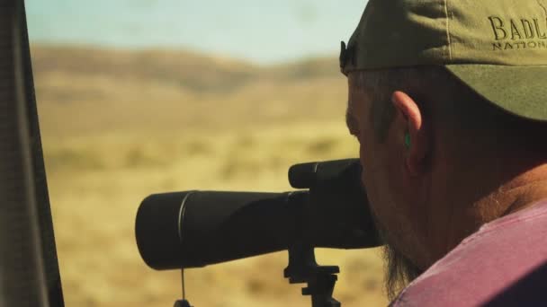 Two People Dialing Target Spotting Scope — Stockvideo