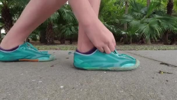 Young Runner Fixing Laces Shoes — Stockvideo