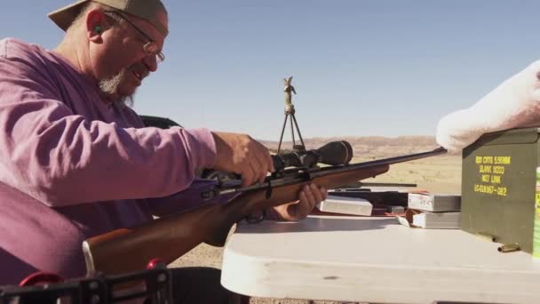 Man Adjusting His Rifle Scope Gun Range — стоковое видео
