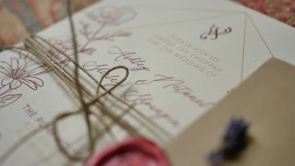 Rearward Bokeh Shot Moving Wedding Invitation Card Wrapped Organic String — Wideo stockowe