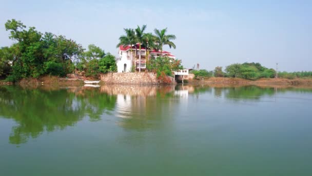 Aerial Drone Travel Teal Lake Luxurious Summer House Statue Hindu — стокове відео