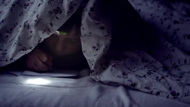 Little Boy Headlamp Hidden Covers Writes His Secret Diary Night — Vídeo de Stock