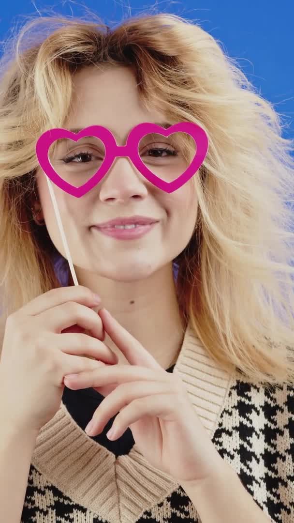 Vertical Video Pretty Blonde Caucasian Woman Heart Shaped Eye Mask — Stock Video