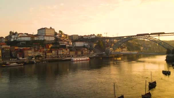 Ascending Aerial Shot Showing Golden River City Puerto Sunrise Train — Stockvideo