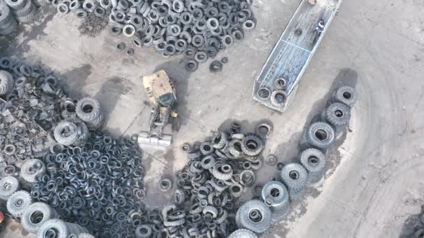 Aerial Top Shot Rubber Recycling Scrapyard Employee Front Loader Sorts — Video Stock