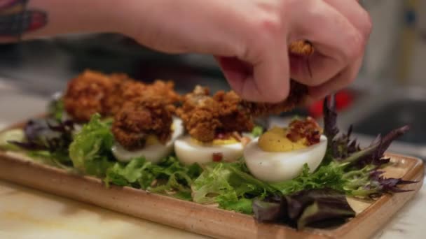 Chef Places Fried Oyster Top Deviled Egg Slow Motion Close — Stock Video