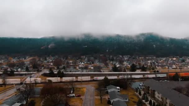 Train Crossing Old Town Mountain Range Background Covered Thick Fog — Stockvideo