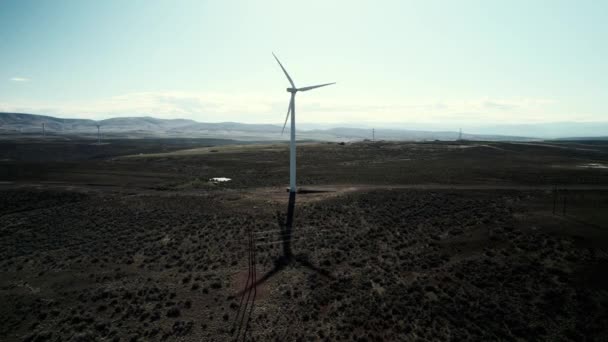 Single Wind Turbine Desert Long Shadow Slow Aerial Orbit — Stockvideo