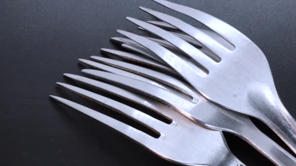 Detail Shot Four Steel Forks Face Black Bacground Rotating Motion — Vídeos de Stock