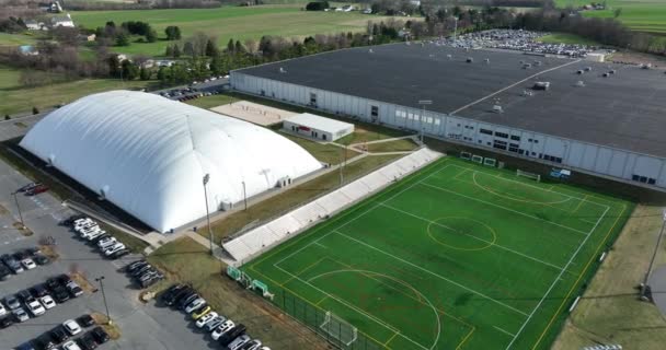 Massive Warehouse Sports Dome Outdoor Field Indoor Sports Arena Aerial — ストック動画