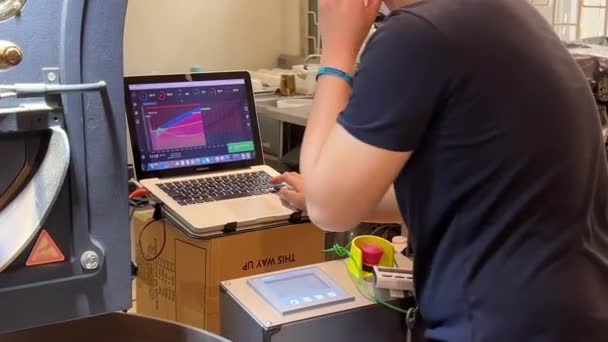 Young Coffee Profession Monitoring Laptop Graphs Display Temperature Heat Control — Stok video