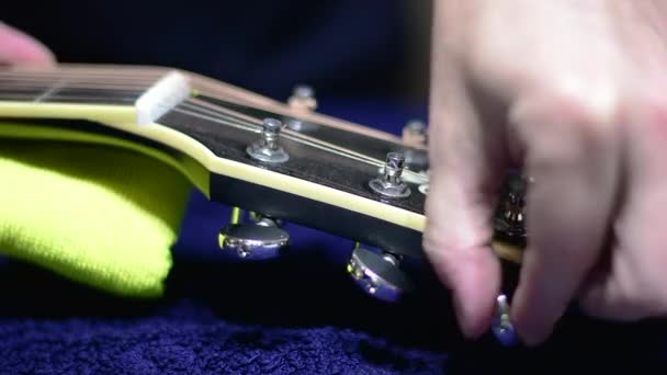 Restringing Cleaning Beautiful Black Single Cutaway Accoustic Guitar Close Loosening — Stockvideo