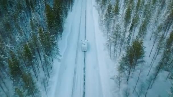 White Camper Driving Snowy Road Lapland Finland Aerial Shot — стокове відео