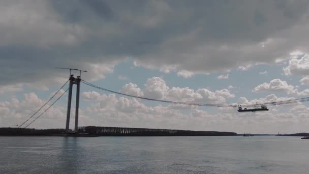 Drone Fly Away Shot Suspended Bridge Big River Cloudy Day — Stockvideo