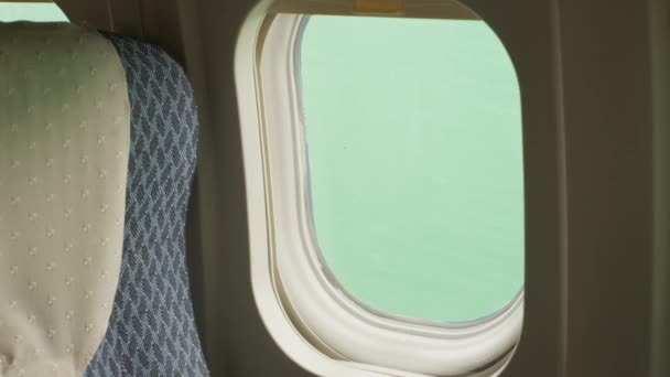 Side Dolly Movement Airplane Seat Window Back Green Screen Backdrop — Vídeos de Stock