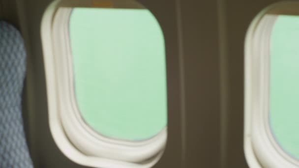 Side Dolly Movement Airplane Seat Window Back Green Screen Backdrop — Vídeos de Stock