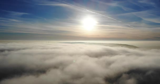 Aerial Backwards Shot Clouds Showing Sun Blue Sky Backdrop — Stockvideo