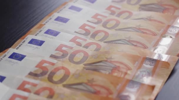 Rack Focus Money Bills Euro Banknotes Line Black Table — Stockvideo