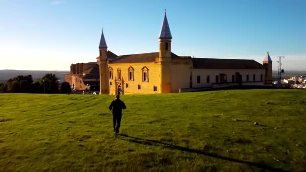 Aerial Dolly Person Jogging Facade University Osuna Seville Background — Stockvideo