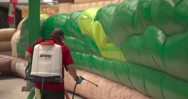 Man Cleaning Inflatables Sprayer Wipes Disinfection Covid Shopping Mall Clean — Stock Video