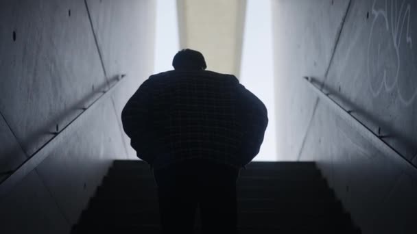 Follow Man Silhouette Wallking Staircase Concrete Walls Slow Motion — стоковое видео