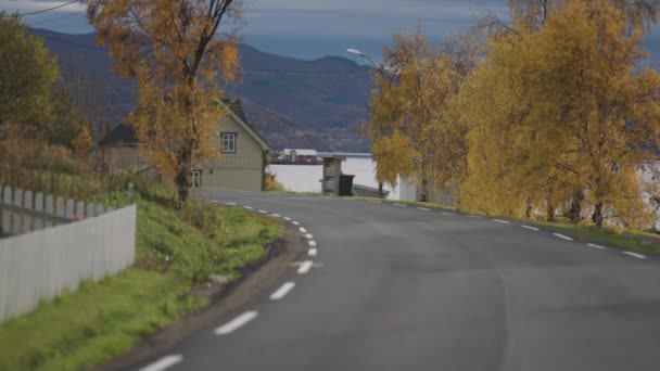 Narrow Road Goes Coastal Village Neat Fences Houses Both Sides — Stock Video