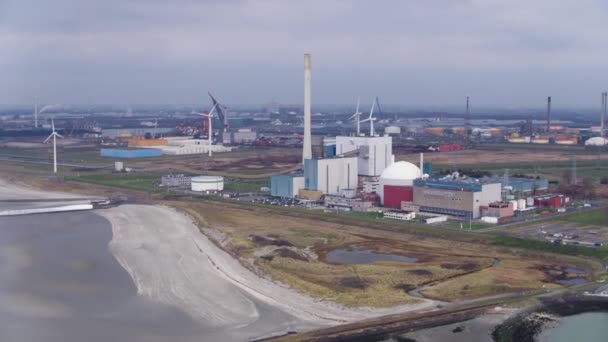 Flight Borssele Nuclear Power Plant Surrounded Spinning Wind Turbines — Video Stock