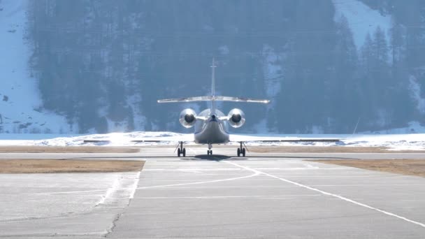 Rear Shot Private Jet Taxiing Runway Departure Winter Mountains — Vídeos de Stock