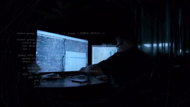 Man Seated Computer Desk Dark Room Writing Data Streaming — Vídeo de stock