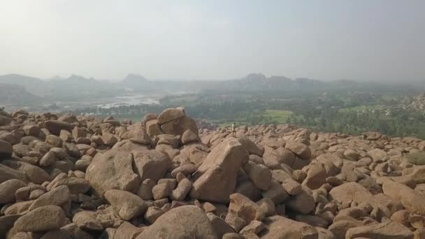 Aerial Orbits Lone Man Massive Granite Stones Hampi India — Videoclip de stoc