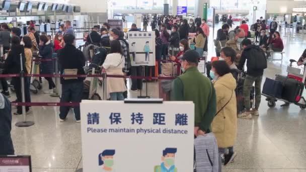 Passengers Wait Line Airline Check Counter Sign Reminds People Keep — Stock video