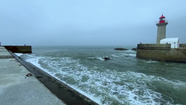 Slow Motion Stormy Waves Crashing Wall Port Oporto Lighthouse Cloudy — Stock Video