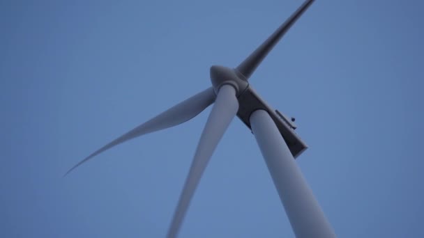 Low Angle Close Shot Working Wind Turbine Clear Blue Sky — Video