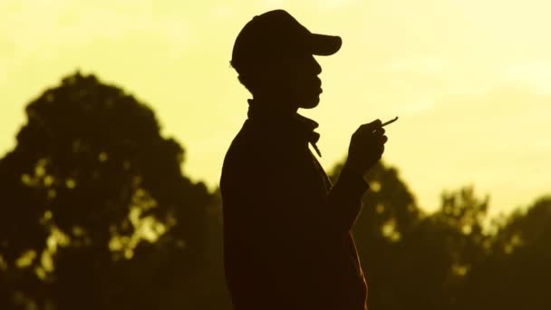 Young Man Smoking Cigarette Front Sunset Nairobi Africa — Video