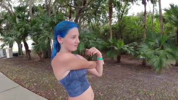 Young Girl Stretching Her Arms Going Run — Stock Video