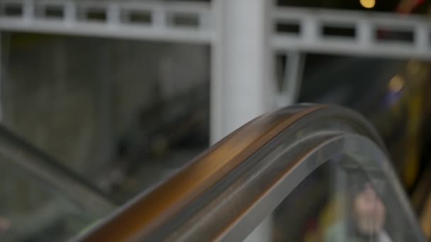 Relaxed Man Rides Escalator Hand Guard Rail — Stockvideo