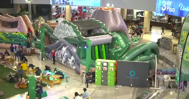 Children Playing Jumping Inflatable Bouncers Lots Children Play Area — Stockvideo