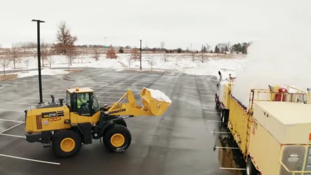 Aerial Snow Plow Tractor Dumping Bucket Full Snow Snow Melter — Stock videók