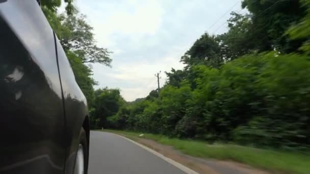 Side Moving Vehicle Showing Both Road Spinning Wheels — Vídeo de Stock