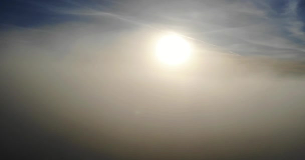 Aerial Shot Thick Cloud Passing Sun Blue Sky — стоковое видео