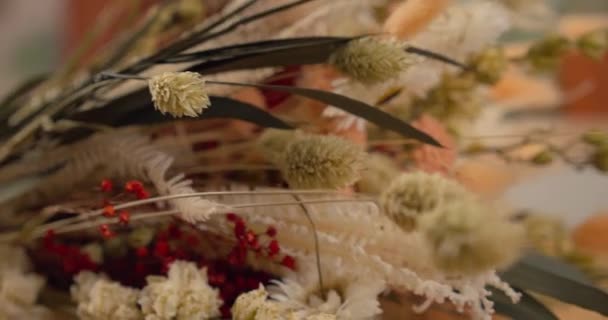 Close Dried Flowers Bouquet Orange Tones Table Dolly Right Shallow — Stock videók