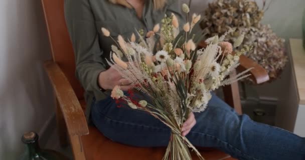 Woman Sitting Armchair Bouquet Flowers Hands Gimbal High Angle — Stock Video