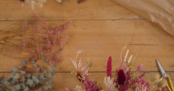 Beautiful Dried Flower Arrangement Being Placed Table Gimbal Top View — Stock Video