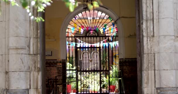 Man Walking Front Gate Andalusian Patio — стоковое видео